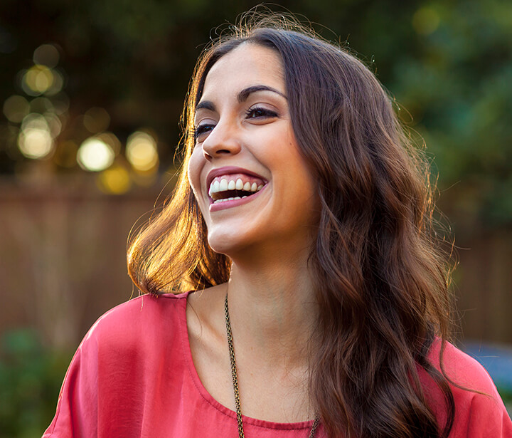  Image of a woman smiling.